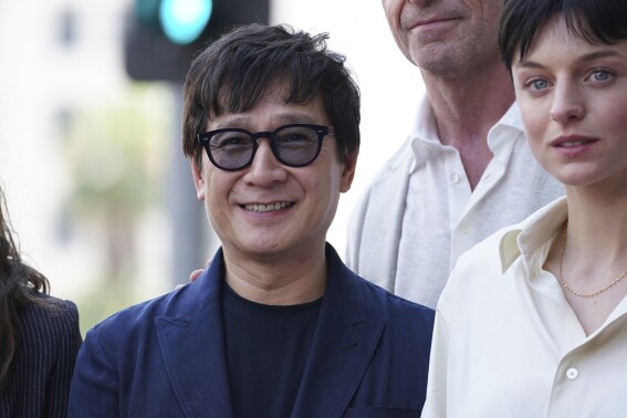 Ke Huy Quan, left and Emma Corrin attend a ceremony honoring Kevin Feige with a star on the Hollywood Walk of Walk of Fame on Thursday, July 25, 2024, in Los Angeles. (Photo by Jordan Strauss/Invision/AP)