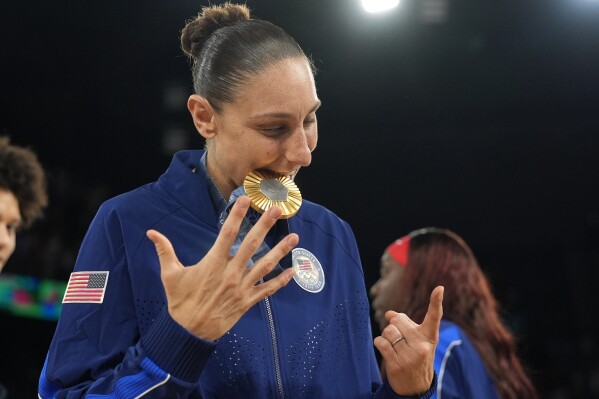 United States' Diana Taurasi reacts after winning aher sixth gold medal at Bercy Arena at the 2024 Summer Olympics, Sunday, Aug. 11, 2024, in Paris, France. (AP Photo/Mark J. Terrill)