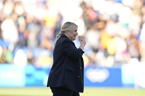 head coach Emma Hayes of the United States celebrates after defeating Brazil during the women's soccer gold medal match between Brazil and the United States at the Parc des Princes during the 2024 Summer Olympics, Saturday, Aug. 10, 2024, in Paris, France. (AP Photo/Francisco Seco)