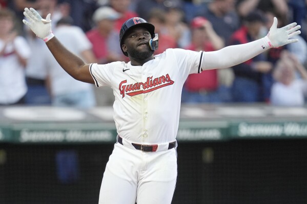 Cleveland Guardians' Jhonkensy Noel celebrates as he crosses home plate with a home run in the fourth inning of a baseball game against the Chicago Cubs, Monday, Aug. 12, 2024, in Cleveland. (AP Photo/Sue Ogrocki)