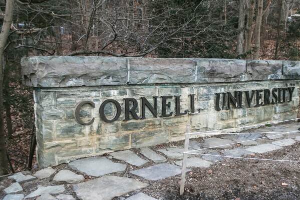 FILE - A Cornell University sign is seen on the Ivy League school's campus, Jan. 14, 2022, in Ithaca, N.Y. Patrick Dai, a former Cornell University student arrested for posting violently threatening statements against Jewish people on campus last fall after the start of the war in Gaza was sentenced to 21 months in prison Monday, Aug. 12, 2024. (AP Photo/Ted Shaffrey, File)