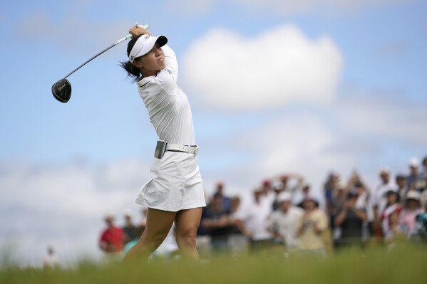 Lydia Ko, of New Zealand, hits her shot from the 12th tee during the third round of the women's golf event at the 2024 Summer Olympics, Friday, Aug. 9, 2024, at Le Golf National, in Saint-Quentin-en-Yvelines, France. (AP Photo/George Walker IV)