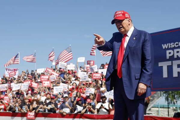 Republican presidential candidate former President Donald Trump walks to the podium at a campaign event Tuesday, June 18, 2024, in Racine, Wis. (AP Photo/Jeffrey Phelps)