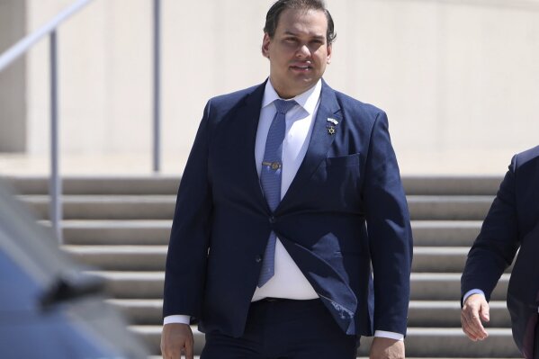 Former U.S. Rep. George Santos leaves federal court following a hearing in is fraud trial, Tuesday, Aug. 13, 2024, in Central Islip, N.Y. (James Carbone/Newsday via AP)