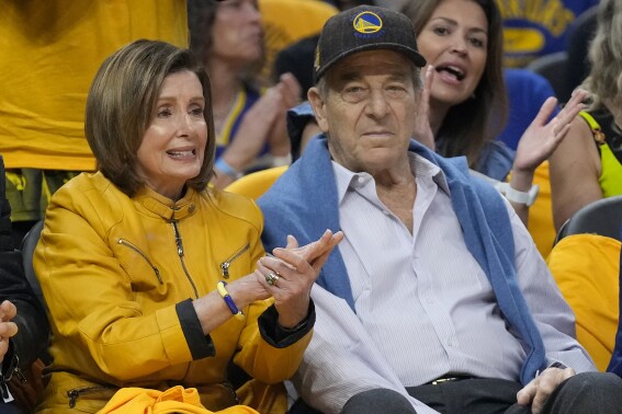 FILE - Rep. Nancy Pelosi, D-Calif., left, and her husband, Paul, watch during Game 4 in the first round of the NBA basketball playoffs between the Golden State Warriors and the Sacramento Kings in San Francisco, April 23, 2023. (AP Photo/Jeff Chiu, File)