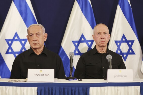 FILE -Israeli Prime Minister Benjamin Netanyahu, left and Defense Minister Yoav Gallant attend a press conference in the Kirya military base in Tel Aviv, Israel, Oct. 28, 2023. (Abir Sultan/Pool Photo via AP, File)