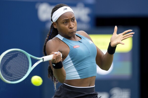 United States' Coco Gauff hits a return to China's Yafan Yang during the National Bank Open tennis tournament in Toronto , Thursday, Aug. 8, 2024. (Frank Gunn/The Canadian Press via AP)