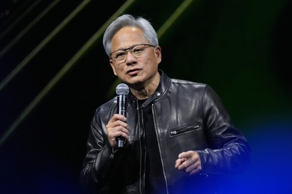 Jensen Huang, chief executive officer of Nvidia, speaks at SIGGRAPH 2024, the premier conference on computer graphics and interactive techniques, in the Colorado Convention Center, Monday, July 29, 2024, in Denver. (AP Photo/David Zalubowski)