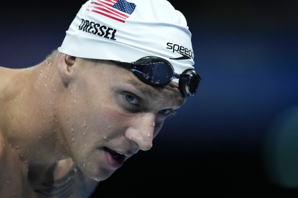 Caeleb Dressel of United States, warms up ahead of the men's 50-meter freestyle final at the 2024 Summer Olympics, Friday, Aug. 2, 2024, in Nanterre, France. (AP Photo/Natacha Pisarenko)