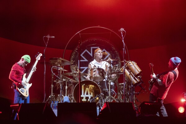 FILE - Members of the Red Hot Chili Peppers from left to right, Flea, Chad Smith, and John Frusciante perform during the Global Citizen Festival on Sept. 23, 2023, at Central Park in New York. (AP Photo/Yuki Iwamura, File)