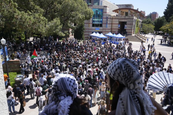 FILE - Students gather on the UCLA campus to protest the Israel-Hamas War, April 29, 2024, in Los Angeles. A federal judge ordered Monday, July 29, that UCLA craft a plan to protect Jewish students, months after pro-Palestinian protests broke out on campus. (AP Photo/Damian Dovarganes,File)