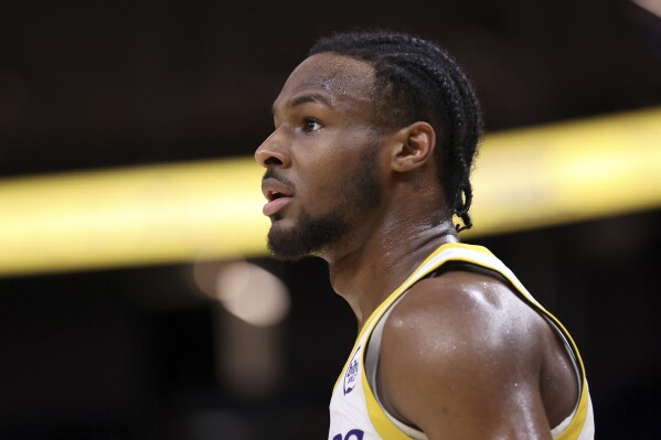 Los Angeles Lakers' Bronny James looks on during an NBA summer league basketball game against the Miami Heat in San Francisco on Wednesday, July 10, 2024. (Scott Strazzante/San Francisco Chronicle via AP)