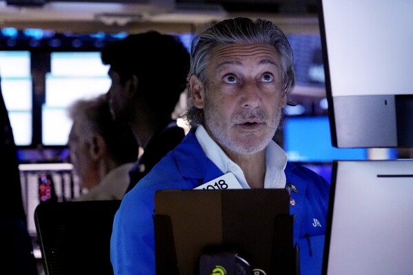 Trader John Romolo works on the floor of the New York Stock Exchange, Tuesday, Aug. 6, 2024.(AP Photo/Richard Drew)