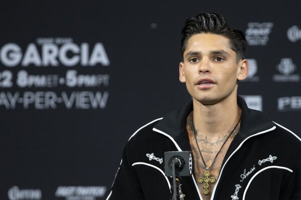 FILE - Super lightweight boxer Ryan Garcia speaks during a news conference at the MGM Grand hotel-casino Thursday, April 20, 2023, in Las Vegas. Ryan Garcia was expelled by the World Boxing Council on Thursday after he repeatedly used racial slurs against Black people and disparaged Muslims in comments livestreamed on social media. (Steve Marcus/Las Vegas Sun via AP, File)