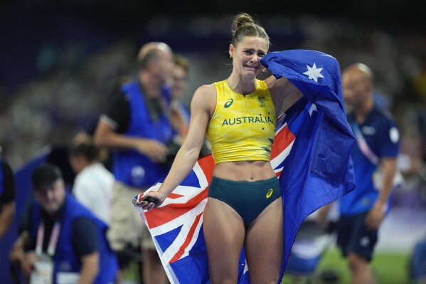 Nina Kennedy, of Australia, reacts after winning the women's pole vault final at the 2024 Summer Olympics, Wednesday, Aug. 7, 2024, in Saint-Denis, France. (AP Photo/Rebecca Blackwell)