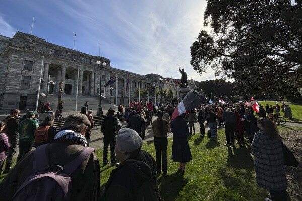 Protestors from the Māori iwi (tribe) Ngāpuhi and others gather outside the Parliament building in Wellington, New Zealand, Monday, Aug. 5 to protest the government’s plans to remove recognition of a child’s Māori heritage from the law governing the child protection system. (AP Photo/Charlotte Graham-McLay)