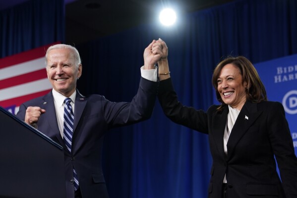 FILE - President Joe Biden and Vice President Kamala Harris stand on stage at the Democratic National Committee winter meeting, Feb. 3, 2023, in Philadelphia. (AP Photo/Patrick Semansky, File)