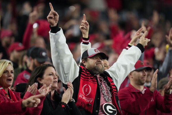 FILE - Georgia fans cheer during the second half of the national championship NCAA College Football Playoff game between Georgia and TCU, Monday, Jan. 9, 2023, in Inglewood, Calif. (AP Photo/Ashley Landis, File)