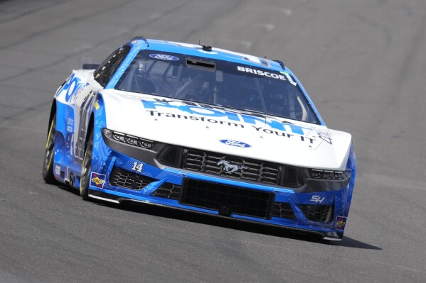 Chase Briscoe drives into a turn during a practice session for the NASCAR Cup Series auto race at Indianapolis Motor Speedway, Friday, July 19, 2024, in Indianapolis. (AP Photo/Darron Cummings)