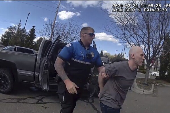 FILE - In this photo made from body camera footage and released by the Twin Falls, Idaho, Police Department, Skylar Meade, right, is arrested in Twin Falls on Thursday, March 21, 2024. An Idaho prosecutor says he will seek the death penalty against an Idaho inmate charged with killing a man while he was on the lam during a 36-hour escape from prison. (Twin Falls Police Department via AP, File)