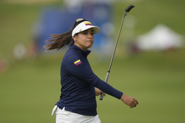 Maria Jose Uribe, of Colombia, reacts after missing a putt on the 13th green during the third round of the women's golf event at the 2024 Summer Olympics, Friday, Aug. 9, 2024, at Le Golf National, in Saint-Quentin-en-Yvelines, France. (AP Photo/Matt York)