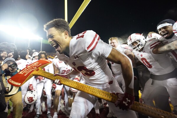 FILE - Wisconsin wide receiver Chimere Dike (13) celebrates after the 28-14 win against Minnesota of an NCAA college football game Saturday, Nov. 25, 2023, in Minneapolis. (AP Photo/Abbie Parr)