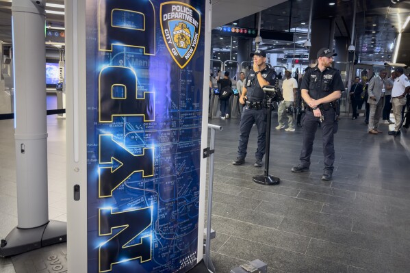 Gun detection machines are tested at the Fulton Street transit station before a news conference with New York Mayor Eric Adams, Friday, July 26, 2024, in New York. New York City is turning to AI-powered scanners in a new bid to keep guns out of its subway system. (AP Photo/John Minchillo)