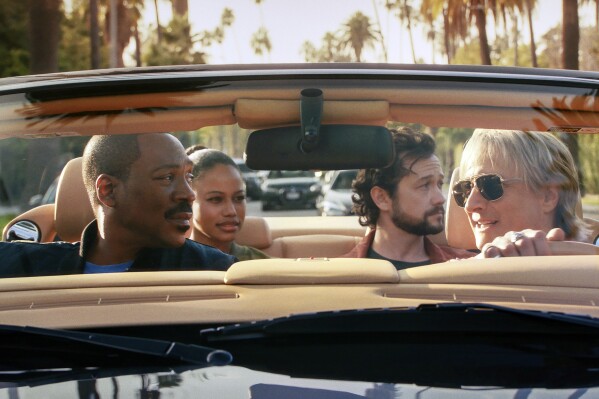 his image released by Netflix shows Eddie Murphy, from left, Taylour Paige, Joseph Gordon-Levitt and Bronson Pinchot in "Beverly Hills Cop: Axel F." (Netflix via AP)