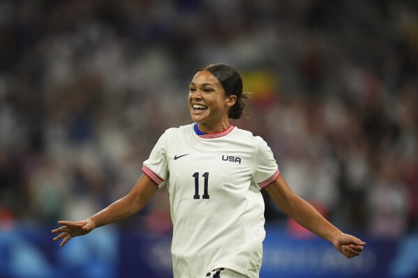 United States' Sophia Smith celebrates after scoring her side's first goal, during the women's Group B soccer match between the United States and Germany at the Velodrome stadium, during the 2024 Summer Olympics, Sunday, July 28, 2024, in Marseille, France. (AP Photo/Daniel Cole)