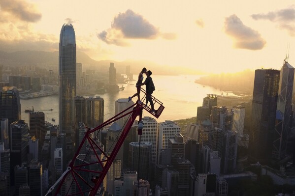 This image released by Netflix shows Ivan Beerkus, right, and Angela Nikolau in a scene from "Skywalkers: A Love Story." (Netflix via AP)