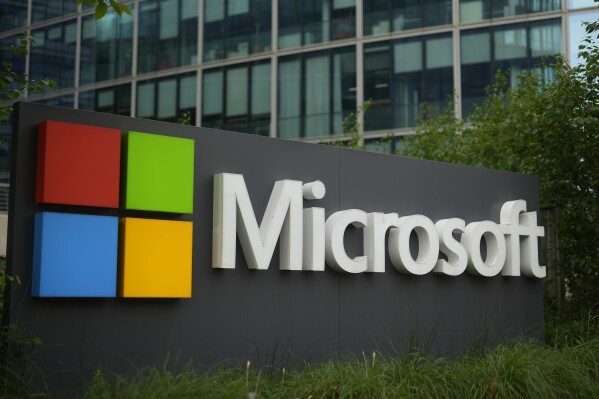 FILE - The Microsoft logo is displayed outside its French headquarters in Issy-les-Moulineaux, outside Paris, May 13, 2024. (AP Photo/Thibault Camus, File)