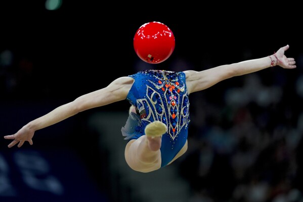 Stiliana Nikolova, of Bulgaria performs in the rhythmic gymnastics individuals all-round qualification round, at La Chapelle Arena at the 2024 Summer Olympics, Thursday, Aug. 8, 2024, in Paris, France. (AP Photo/Francisco Seco)