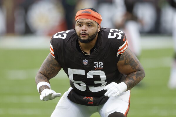 FILE - Cleveland Browns center Nick Harris (53) warms up during the second half of an NFL football game against the Jacksonville Jaguars, Sunday, Dec. 10, 2023, in Cleveland. (AP Photo/Ron Schwane, File)