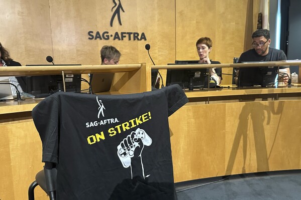 SAG-AFTRA committee members and members of the board gather for a news conference at the SAG-AFTRA headquarters in Los Angeles on Thursday, July 25, 2024. Hollywood's video game performers voted to go on strike Thursday, throwing part of the entertainment industry into another work stoppage after talks for a new contract with major game studios broke down over artificial intelligence protections. (AP Photo/Eugene Garcia)