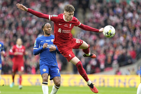 FILE - Liverpool's Conor Bradley, front, controls the ball during the English League Cup final soccer match between Chelsea and Liverpool in London, Feb. 25, 2024. (AP Photo/Dave Shopland, File)