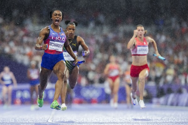 Sha'carri Richardson, of the United States, celebrates after winning the women's 4 x 100-meter relay final at the 2024 Summer Olympics, Friday, Aug. 9, 2024, in Saint-Denis, France. (AP Photo/Petr David Josek)