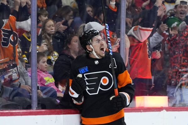 FILE - Philadelphia Flyers' Travis Konecny reacts after scoring a goal during the second period of an NHL hockey game against the Boston Bruins, March 23, 2024, in Philadelphia. The Flyers have signed the All-Star forward to an eight-year extension worth $70 million. The deal announced Thursday, July 25, 2024 keeps Konecny under contract through the 2032-33 NHL season. (AP Photo/Matt Slocum, file)