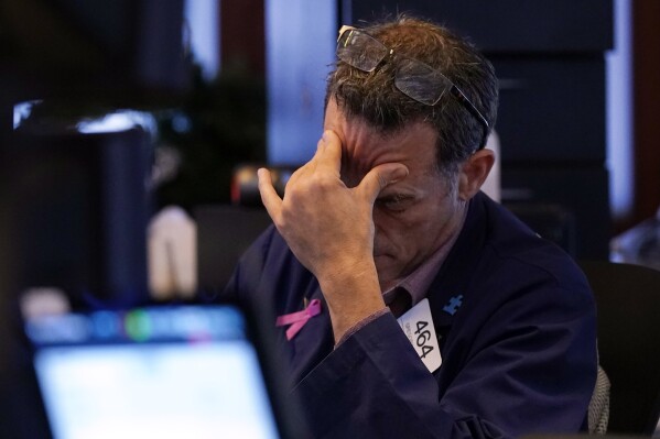 Trader Gregory Rowe works on the floor of the New York Stock Exchange, Monday, Aug. 5, 2024.(AP Photo/Richard Drew)