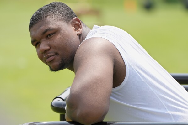 Cleveland Browns defensive tackle Mike Hall Jr. waits for his turn to speak at a news conference during an NFL football training camp practice Saturday, July 27, 2024, in White Sulphur Springs, W.Va. (AP Photo/Sue Ogrocki)