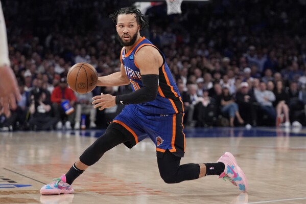 FILE - New York Knicks' Jalen Brunson looks to pass the ball during the second half of Game 5 in an NBA basketball second-round playoff series against the Indiana Pacers, May 14, 2024, in New York. Brunson has agreed to a four-year contract extension worth about $156.5 million with the Knicks, a person with knowledge of the details said Friday, July 12, 2024. (AP Photo/Frank Franklin II, File)