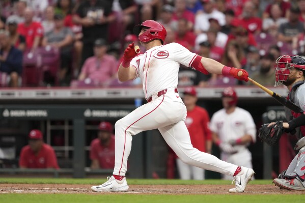 Cincinnati Reds' Spencer Steer follows through on a three-run home run during the fifth inning of a baseball game against the St. Louis Cardinals, Monday, Aug. 12, 2024, in Cincinnati. (AP Photo/Kareem Elgazzar)