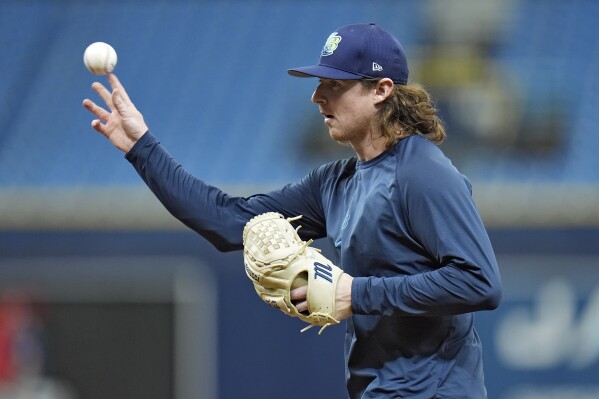 Tampa Bay Rays pitcher Ryan Pepiot warms up before a baseball game against the Houston Astros Monday, Aug. 12, 2024, in St. Petersburg, Fla. Pepiot has on the injured list with a leg infection. (AP Photo/Chris O'Meara)