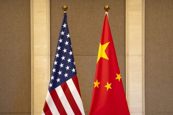 FILE - U.S. and Chinese flags are set up at the Diaoyutai State Guesthouse in Beijing, on July 8, 2023. Lured by the large U.S. market, Chinese businesses are coming to the U.S. with money, jobs and technology, only to find rising suspicion at a time of an intensifying U.S.-China rivalry that has spread into the business world. (AP Photo/Mark Schiefelbein, Pool, File)