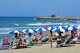 FILE - People enjoy a sunny day at an establishment on the beach in Tuscany's Castiglione della Pescaia, Italy, Sunday, May 24, 2020. (Jennifer Lorenzini/LaPresse via AP)