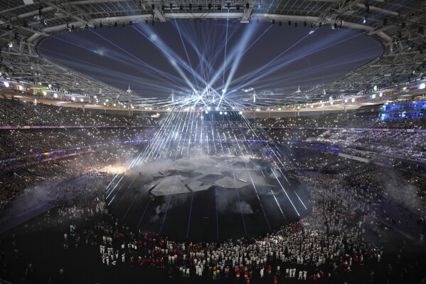 Participants attend the 2024 Summer Olympics closing ceremony at the Stade de France, Sunday, Aug. 11, 2024, in Saint-Denis, France. (AP Photo/Kin Cheung)