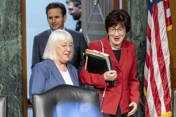 FILE - Chair Sen. Patty Murray, D-Wash., left, and Vice Chair Sen. Susan Collins, R-Maine, right, arrives for a Senate Appropriations hearing, on Capitol Hill in Washington, May 16, 2023. The Senate will pursue a spending increase next year of about 3.4% for defense and 2.7% increase for non-defense programs under a bipartisan agreement reached by the Senate Appropriations Committee. The deal reached by Sens. Patty Murray and Susan Collins sets up a certain clash later this year with the House, which is pursuing less spending in both categories. (AP Photo/Andrew Harnik, File)