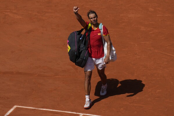 Spain's Rafael Nadal leaves the court after losing to Serbia's Novak Djokovic in their men's singles second round match at the Roland Garros stadium at the 2024 Summer Olympics, Monday, July 29, 2024, in Paris, France. Novak Djokovic dominated rival Rafael Nadal to win 6-1, 6-4 at the Paris Olympics in the second round. (AP Photo/Manu Fernandez)