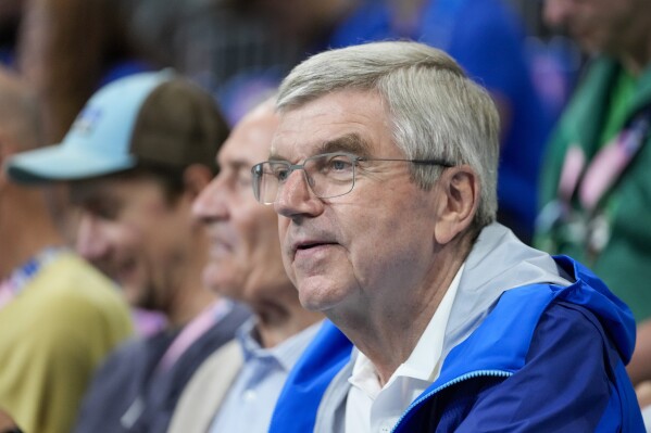 Thomas Bach, President of the International Olympic Committee attends a quarterfinal handball match between Germany and France at the 2024 Summer Olympics, Wednesday, Aug. 7, 2024, in Villeneuve-d'Ascq, France. (AP Photo/Brian Inganga)