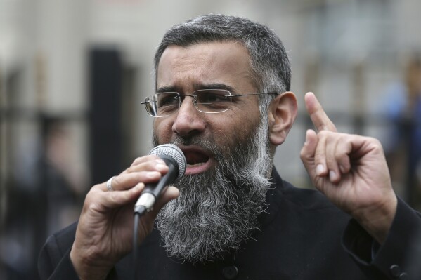 FILE - This is a Friday, April 3, 2015 file photo of Anjem Choudary, a British Muslim social and political activist and spokesman for Islamist group, Islam4UK, speaks following prayers at the Central London Mosque in Regent's Park, London, April 3, 2015. Radical British preacher Anjem Choudary, who was previously convicted of supporting the so-called Islamic State, was found guilty Tuesday by an London jury on terrorism-related charges. (AP Photo/Tim Ireland, File)