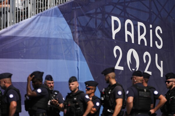 Security work during the canoe sprint competitions at the 2024 Summer Olympics, Saturday, Aug. 10, 2024, in Vaires-sur-Marne, France. (AP Photo/Lindsey Wasson)